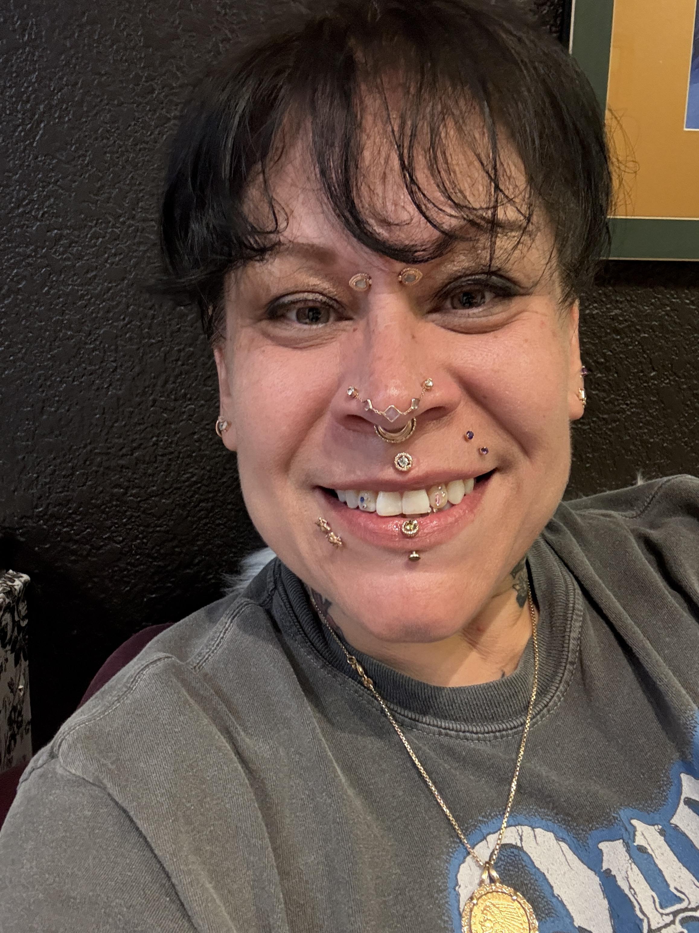 professional body piercer at work